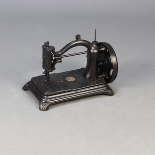 An International Sewing machine 25cm h x 32cm w x 21cm d 