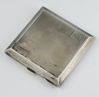 A silver engine turned cigarette case with vacant cartouche, marks rubbed, 124 grams gross
