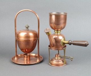 A copper and brass side handled coffee pot and burner, the base marked London RD690219 27cm h, together with a copper egg boiler and stand 30cm h 