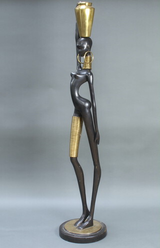 After Karl Hagenauer, a brass and ebonised bronze figure of an female African water carrier 169cm 