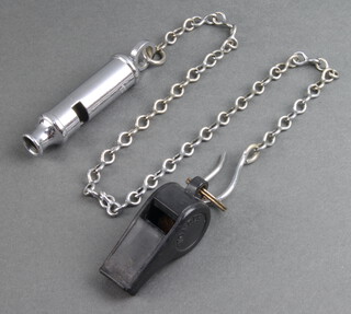A Metropolitan Patent police whistle and chain together with a Wander whistle 
