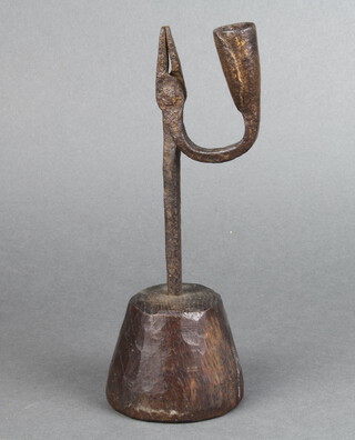 A 17th/18th Century wrought iron rush light holder, raised on a turned oak base 22cm h x 7cm 