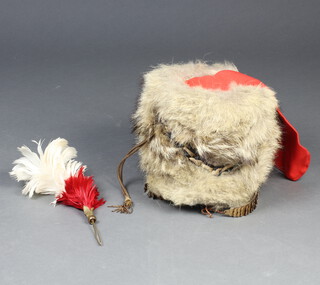 A reproduction Victorian Busby complete with red bag, chin strap and associated heckle/plume 25cm x 24cm 