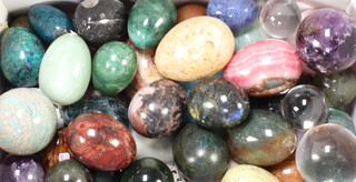 39 various polished hardstone eggs together with 7 glass spears 
