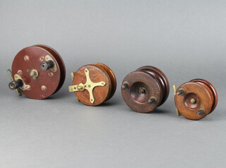 A 19th Century wooden and brass starback centre pin fishing reel 3.5", 2 other wooden and mahogany centre pin fishing reels 3.5" and 2.5", a Bakelite ditto 4 1/2" 