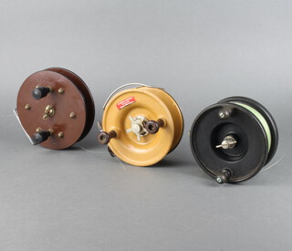 An Alvey centrepin sea fishing reel 5", an Alcocks aerial ditto 5" and a brown Bakelite ditto 5 1/2" 