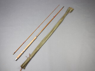 A Robertson of London, a MK.IV Avon split cane two piece 10' fishing rod with red agate butt and tip eyes, in cloth bag 