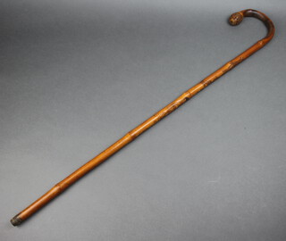 A 19th Century Chinese carved bamboo walking stick decorated figures, the base is signed, 86cm l 