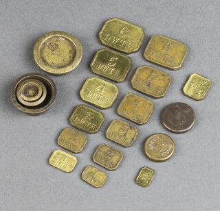A George III weight marked DG58, 7 19th Century lozenge shaped pennyweight weights, 1,2 (x2), 3,4,5 and 6, 3 18th Century bucket weights, a brass weight, an Avery 2 oz weight and 7 gilt metal dwts weights 1/2,1,2,3,4,5 and 6
