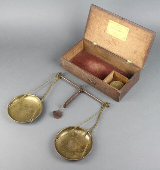 A set of 19th Century W & T Avery of Birmingham polished steel and brass scales together with 7 bronze troy bucket weights - 8oz, 4oz, 2oz, 1oz, 1/2oz, 1/4oz and 1 unmarked (all with verdigris) contained in a an oak box 
