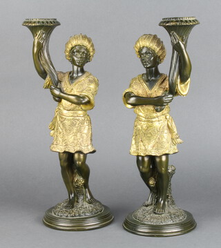 A pair of 18th Century style resin candlesticks in the form of standing liveried servants 39cm x 13cm 
