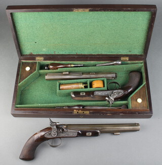 Samuel Nock, a pair of patent patchlock duelling/target pistols, the 26cm Damascus twist barrels marked Samuel Nock 180 Fleet Street London, Gunmakers to His Majesty, the barrel with proofhouse mark and numbered 6467, engraved lock plates signed Samuel Nock, with walnut chequer grip with wadding punch, turn key and cleaning rod, copper and brass powder flask, contained in a mahogany case    