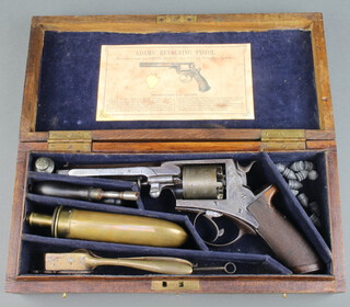 William Tranter, a five shot double action 54 bore octagonal barrel percussion revolver marked W Tranter Patent no.34,378, contained in a fitted leather case with James Dixon & Sons brass powder flask, turn key, nipple key, oiler and brass bullet mould (slightly misshapen), contained in an oak box, the lid labelled Adams revolving pistol 
