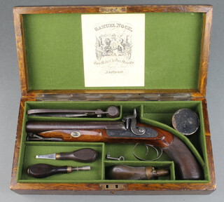 Samuel Nock, a heavy large bore double barrelled Howdah percussion pistol, with walnut stock and chequer grip, the lock plate marked S Nock with stirrup ram rod, the barrel marked S Nock Regent Street, the oak box fitted a cap box with steel bullet mould, cleaning rod, 2 turn keys and a copper and brass powder flask, labelled Samuel Nock and marked Lieutenant Jack Bryant RHA to the top 