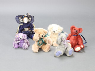 An Orkid Bears grey bear 30cm, 4 other bears and a porcelain headed doll