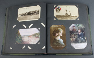An album of 19th Century black and white and coloured postcards, sentimental scenes some first world war 