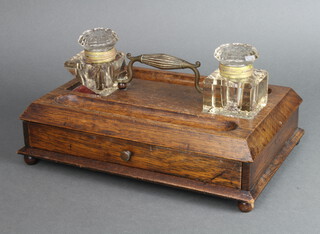 A Victorian rectangular oak standish with associated cut glass inkwells, fitted pen recess, the base with drawer, raised on but feet 10cm h x 34cm w x 22cm d 