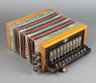 A Regal Melodeon German accordion with 12 buttons 
