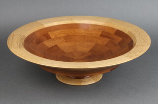 A circular turned parquetry bowl on a spreading foot 13cm h x 41cm diam. 