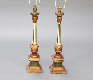 A pair of Rococo style gilt and green painted turned and fluted table lamps raised on square bases 56cm x 13cm x 13cm  