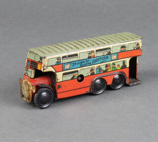 A Wells of London tinplate clockwork bus in red with grey roof bearing advert "Thanks for Buying British" with Union Jack flags