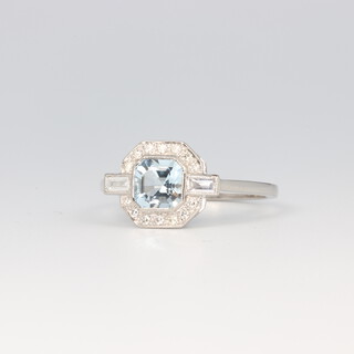 A platinum Art Deco style aquamarine and diamond cocktail ring, the centre square cut stone 0.70ct, the brilliant and baguette cut diamonds 0.25ct, size O 1/2, 3.5 grams 