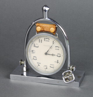 Swayne and Eardly of Piccadilly, a 1930's bedroom timepiece with paper dial and Arabic numerals, contained in a chrome case in the form of a spur 14cm h x 13cm w x 5cm d 