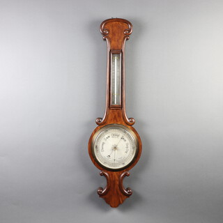 A Victorian aneroid barometer and thermometer with silvered dial contained in a mahogany wheel case 94cm h x 26cm w x 4cm d 