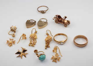 A quantity of 9ct yellow gold jewellery including 2 padlocks, a wedding band, car charm, ring and 2 earrings (1 with stone missing) 16 grams, together with 2 pairs of yellow metal earrings and a pendant 11 grams 