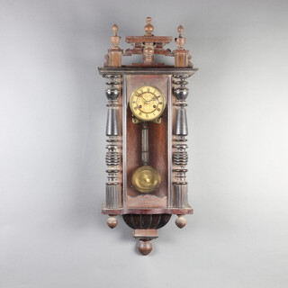 A Vienna style striking regulator with 13cm paper dial, Roman numerals and grid iron pendulum, contained in a walnut case 98cm h x 38cm w x 18cm d 