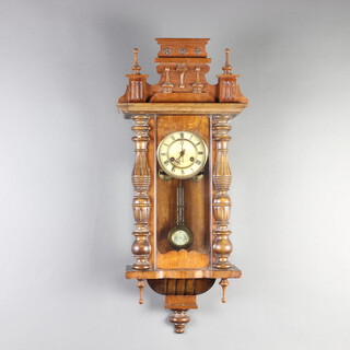 A Vienna style striking regulator with 12cm paper dial, Roman numerals and gridiron pendulum contained in a walnut case 84cm h x 37cm w x 20cm d  