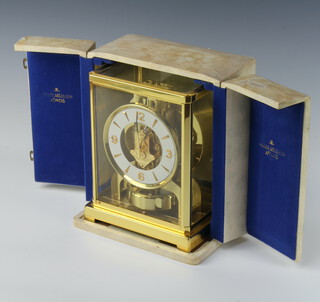 A Jaeger Lecoultre Atmos clock no.526, with white dial and Arabic numerals, contained in a gilt case with original presentation case and instructions 