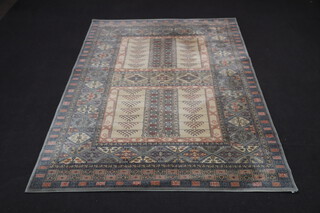 A grey and green ground Persian style machine made carpet with 2 square medallions to the centre within a multi row border 298cm x 202cm 