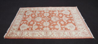 An orange and white ground floral pattern Afghan rug 202cm x 151cm 