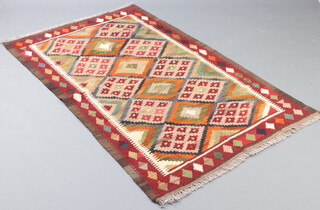 A red, brown and white ground Maimana Kilim rug with all over geometric design 188cm x 118cm 