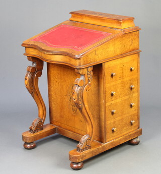 A Victorian inlaid figured walnut Davenport of serpentine outline, the top having stationery box with hinged lid and red tooled leather writing surface above 4 drawers, raised on cabriole supports 84cm h x 54cm w x 55cm d 