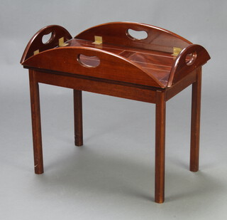A Georgian style mahogany oval butler's tray coffee table raised on square tapered supports with detachable tray 51cm h x 89cm w x 64cm d 