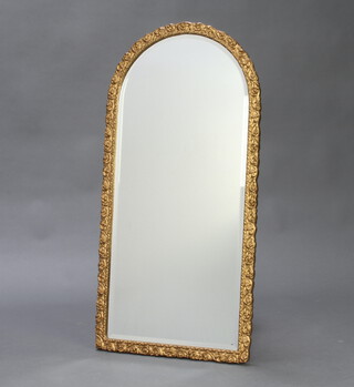 An arch shaped bevelled plate mirror contained in a gilt frame 91cm h x 44cm w 