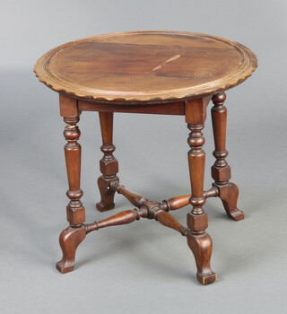 An Edwardian circular walnut occasional table, raised on turned supports with X framed stretcher 45cm h x 49cm diam. 