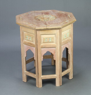 An Eastern bleached hardwood octagonal folding table, the top carved a flower, 61cm h x 56cm w x 56cm d  