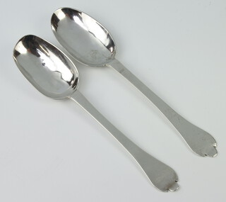 Two early Georgian rat tail table spoons with trefid handles engraved DRM, rubbed marks, 108 grams 