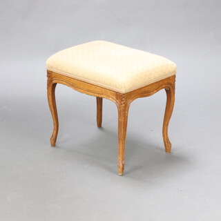 A rectangular Victorian bleached walnut stool with upholstered seat raised on carved cabriole supports 47cm h x 47cm w x 36cm d 