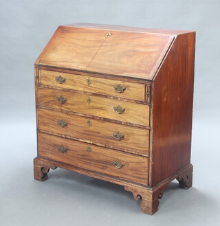 A Georgian mahogany bureau, the fall front revealing a well fitted interior above 4 long drawers with replacement brass swan neck drop handles, raised on bracket feet 109cm h x 96cm w x 54cm w 
