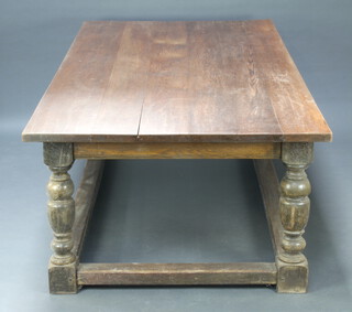 A 17th/18th Century style oak refectory dining table formed of 6 planks, raised on cup and cover supports and box framed stretcher 65cm h x 260cm l x 121cm w 