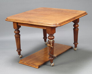 A Victorian mahogany extending dining table raised on turned and fluted supports with later shepherd's casters 72cm h x 102cm w x 104cm without leaf x 143cm with leaf 