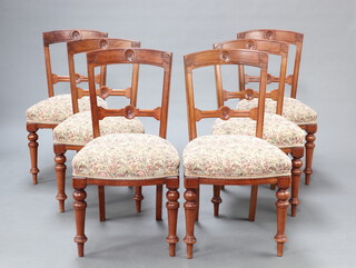 A set of 6 Victorian carved walnut bar back dining chairs with shaped and carved mid rails and overstuffed seats, raised on turned supports 38cm h x 47cm w x 44cm d (seat 26cm x 28cm)  