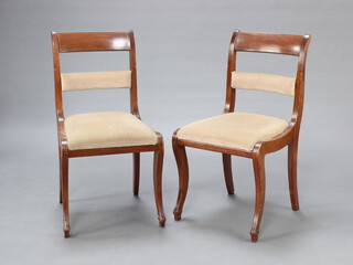 A pair of 19th Century Biedermeier style inlaid mahogany bar back dining chairs with padded mid rail, cane and drop in upholstered seats, raised on sabre supports 89cm h x 48cm w x 46cm d (seats 21cm x 34cm) 