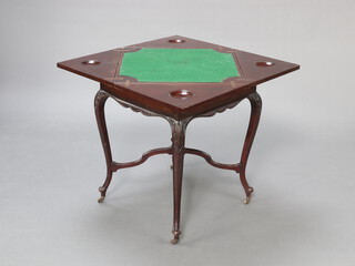 A late Victorian carved mahogany envelope card table fitted a drawer, raised on cabriole supports with X framed stretcher surmounted by a lidded urn, raised on brass casters 75cm h x 55cm w x 55cm d 
