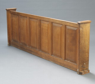 A 19th Century oak pew front of panelled construction 84cm h x 229cm w x 25cm d (inside measurement 84cm h x 219cm w x 14cm d)