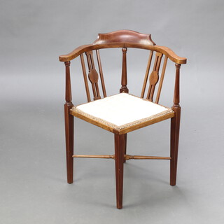 An Edwardian inlaid mahogany corner chair with upholstered seat, raised on turned supports with X framed stretcher 74cm h x 61cm x 57cm (seat 23cm x 25cm)  